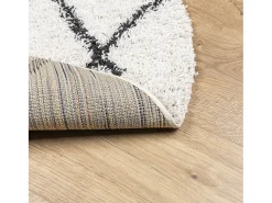 Alfombra moderna de pelo largo en color crema y negro, Ø 100 cm