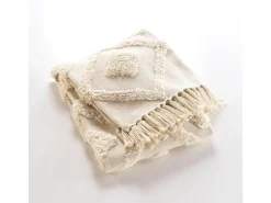 Manta tufted con borlas