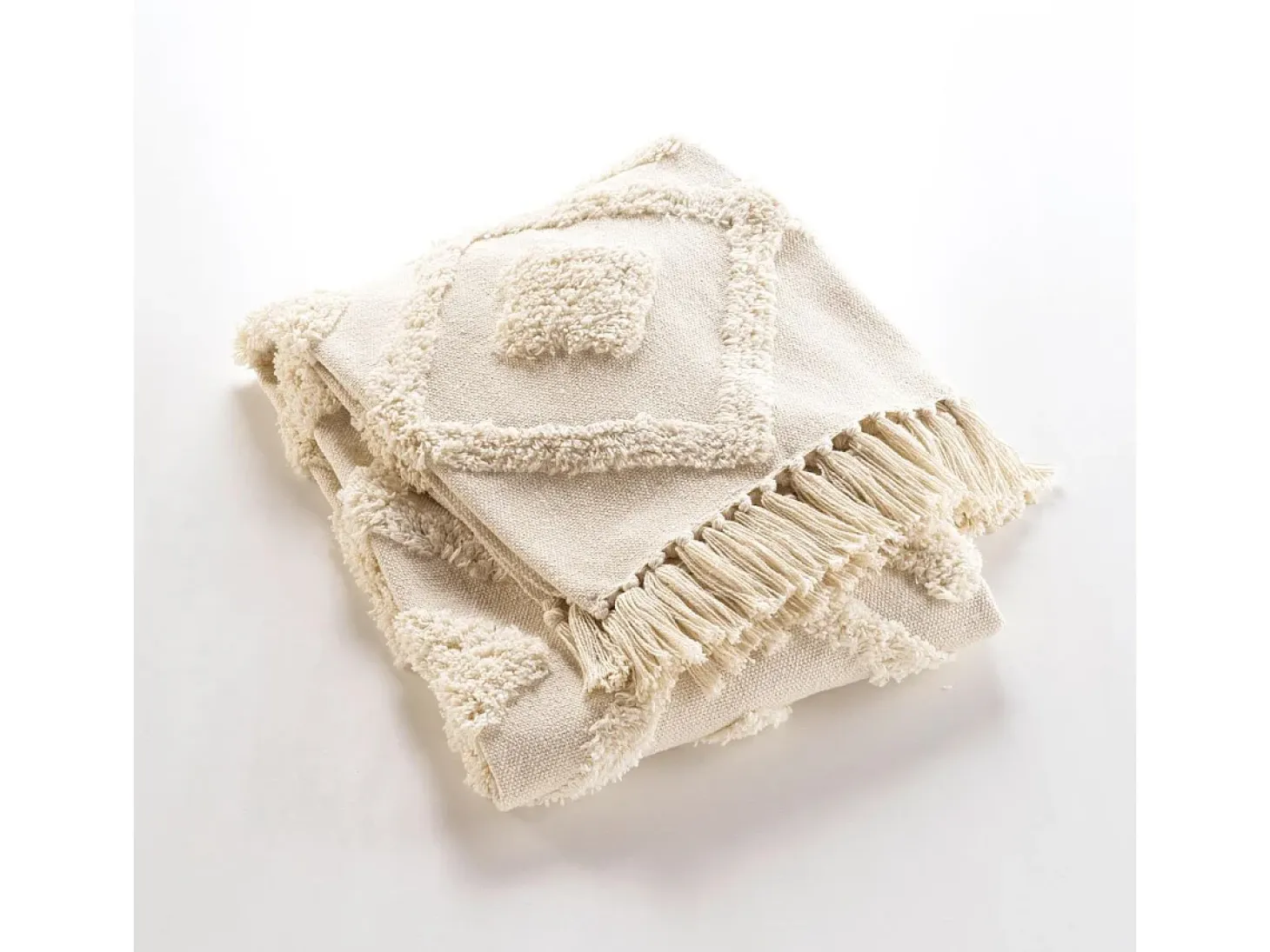 Manta tufted con borlas